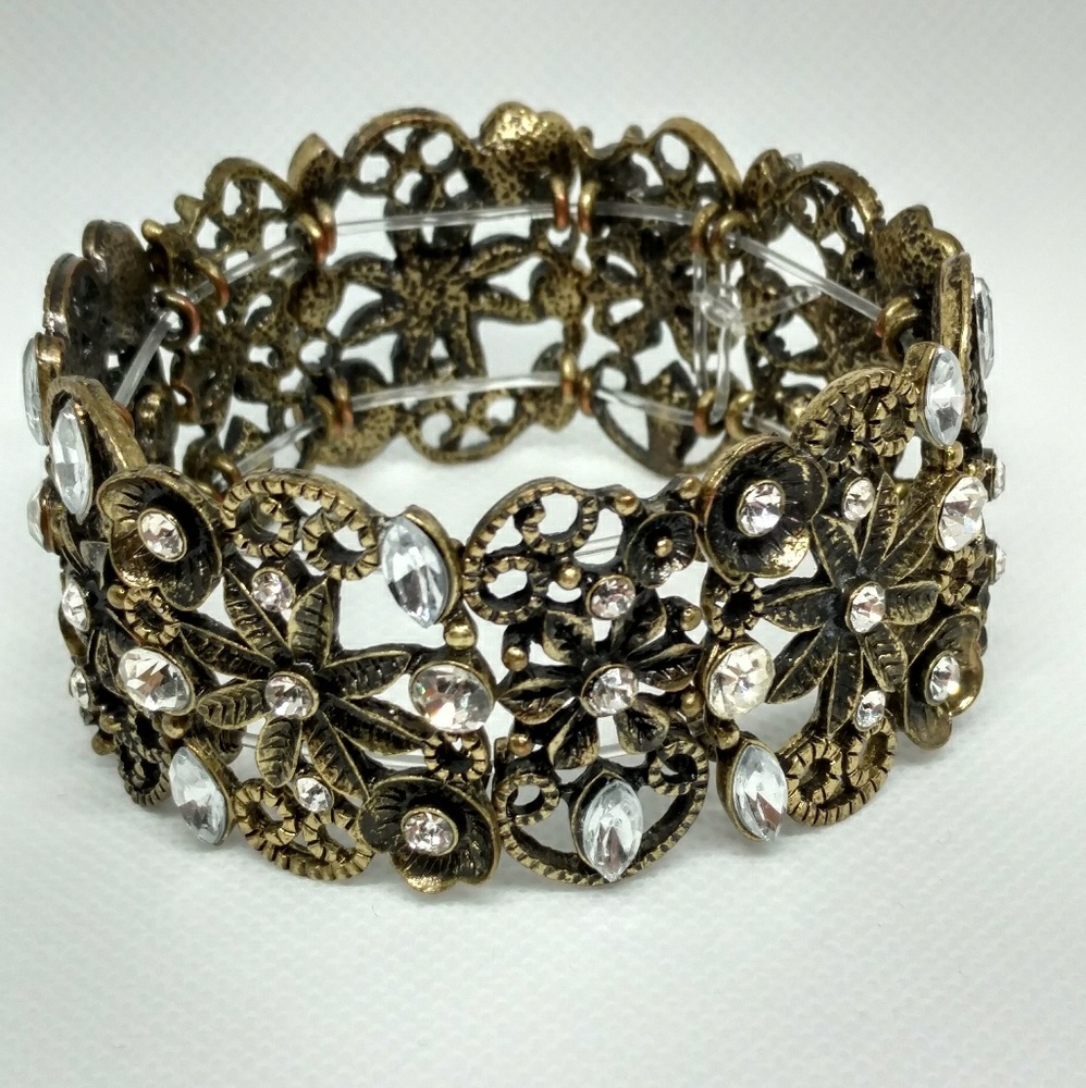 Bronze tone and rhinestone stretch bracelet floral